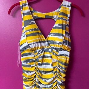 Yellow, grey, and white shirt. Cut out back. M